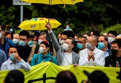 A dozen Hong Kong democracy activists disqualified for election