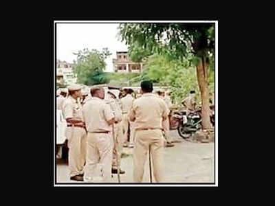 Police force outside the school campus in Dungarpur on Thursday.