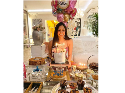 Free Photos - A Young Girl Is Celebrating Her Birthday With A Cake Adorned  With A Single Candle. She Is Happily Posing While Holding The Cake, Wearing  A Bow And Smiling Brightly,