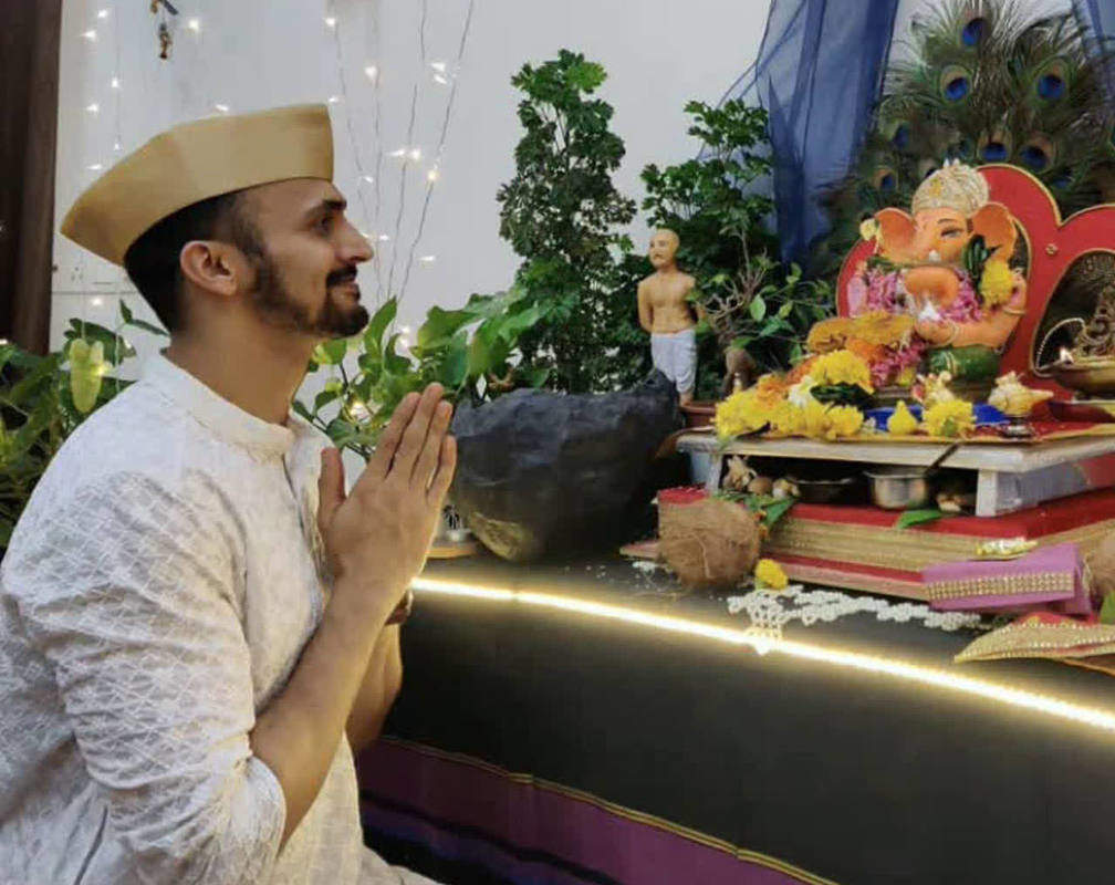 
Bhushan Pradhan gives finishing touches to Bappa with his mom
