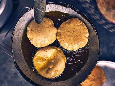 Iron kadhais for preparing deep-fried samosas, pakoras and other delicacies