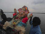 Devotees immerse idols of Lord Ganesha