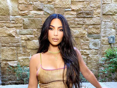 TV star Kim Kardashian stunningly poses on the beach in bronze bikini