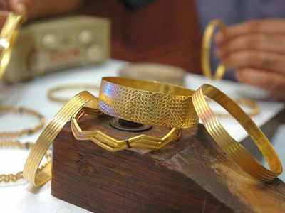 Gold down by Rs 24, silver rises Rs 222