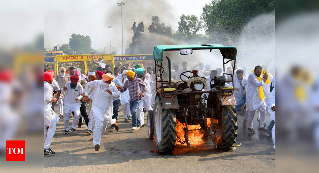 Farm bills: Farmers block roads in Haryana, burn effigies in Punjab; 2 JJP  MLAs join protests | India News - Times of India