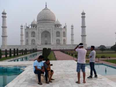 Taj Mahal Reopen News: Tourists queue up as Taj Mahal opens with all  Covid-19 norms in place | Agra News - Times of India