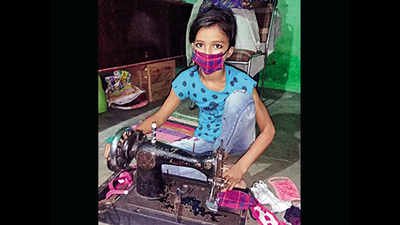 A stitch in time... 12-year-old daughter of waste pickers makes masks for free