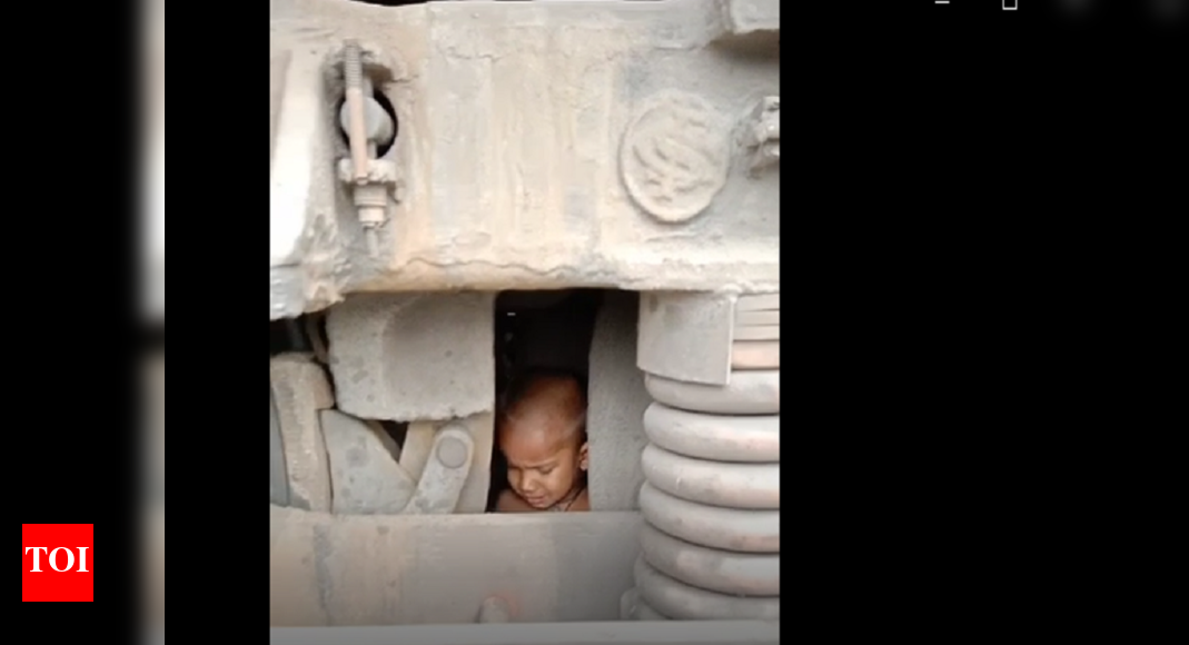 Miraculous escape for 2-year-old stuck under engine of goods train ...