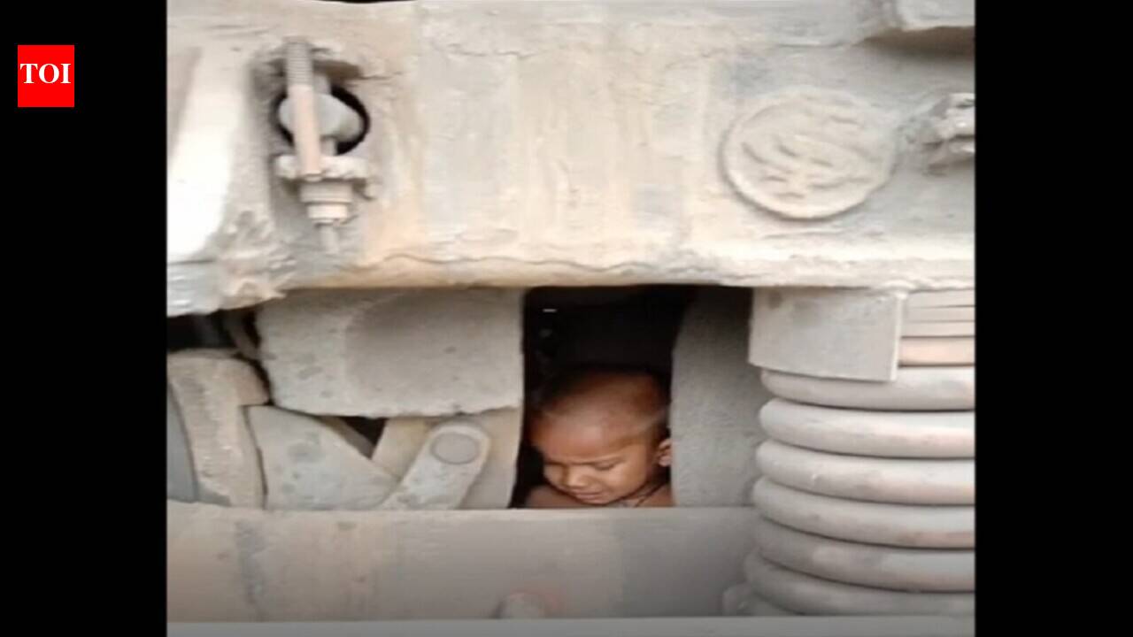 Miraculous escape for 2-year-old stuck under engine of goods train