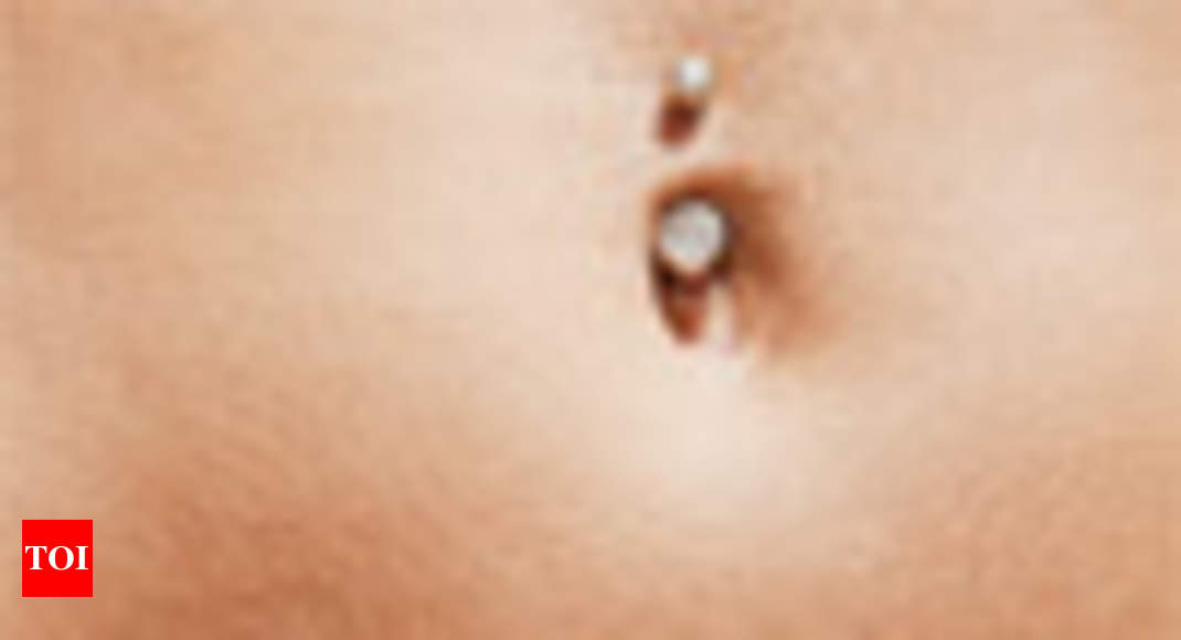 infected belly button piercing signs