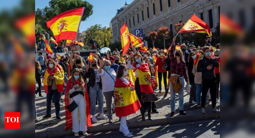 Madrid Lockdown News Waving Spanish flags, Vox supporters protest