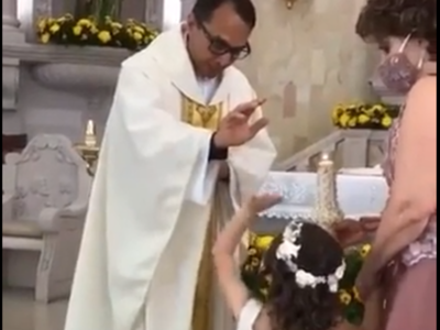 Funny video: Priest raises hand to bless the girl, she gives him high-five