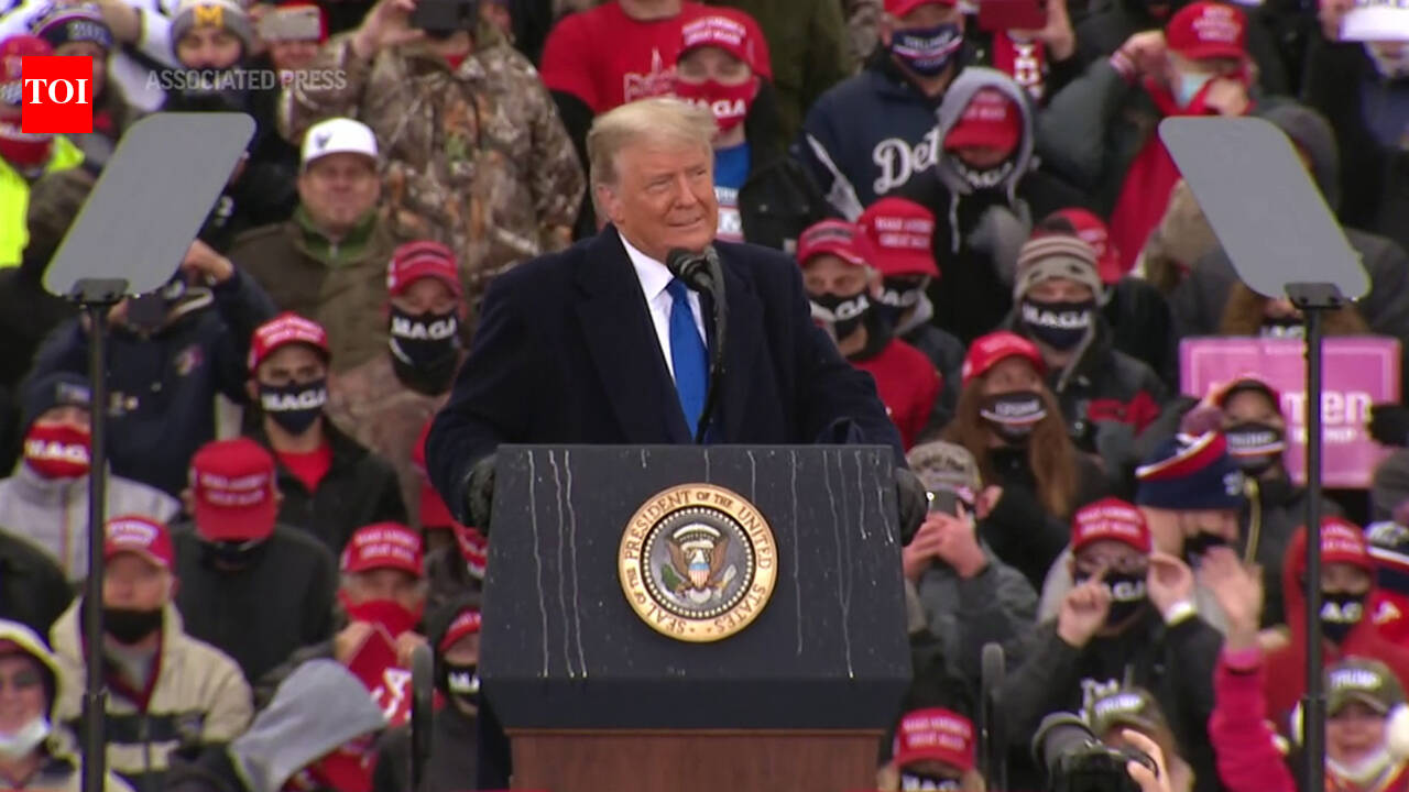 Trump campaigns at rain-soaked Michigan rally