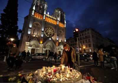 France tightens security after Nice attack, protests flare in parts of Muslim world