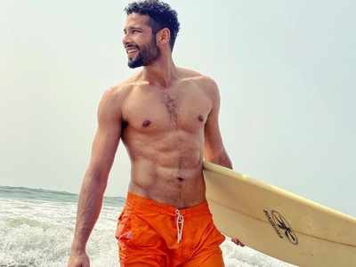 ‘Gully Boy’ actor Siddhant Chaturvedi shows off his washboard abs as he goes surfing in Goa