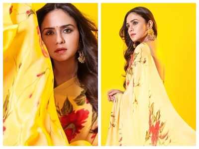 Photos: Amruta Khanvilkar is a sight to behold in this yellow saree