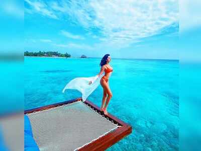 Tara Sutaria stuns in a red bikini as she poses for a birthday picture in the Maldives