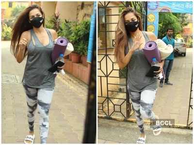 Photos: Malaika Arora waves at the paparazzi as she gets clicked post her yoga session