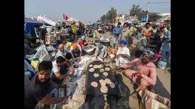 Braving cold, farmers protesting at Delhi's Singhu border say prepared for long haul