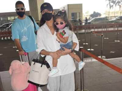 PHOTOS: Neha Dhupia snapped at the Mumbai airport with hubby Angad Bedi and their daughter Mehr