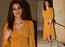 Photos: Kriti Sanon stuns in a golden-yellow dress as she arrives at Manish Malhotra's residence