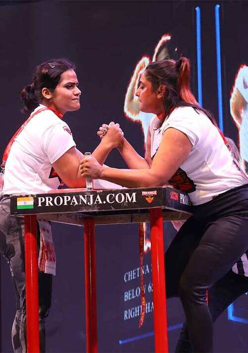 Female wrestling with bicep