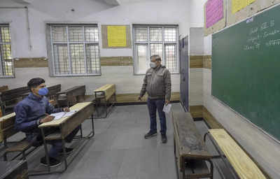 Smiles, sanitizers welcome students as schools reopen in Delhi