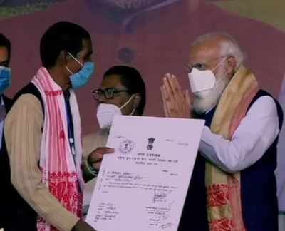 PM Modi distributes land allotment certificates to indigenous people in Assam's Sivasagar