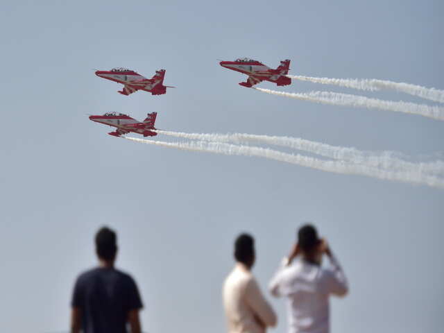 Indian Air Force (IAF)'s acrobatic team, 'Suryakiran', perform a sortie Indian Air Force (IAF)'s acrobatic team, 'Suryakiran', perform a sortie
