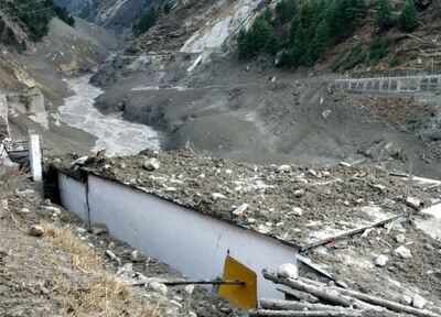 A view shows damage after a Himalayan glacier broke and crashed into a dam at Raini Chak Lata village in Chamoli district of Uttarakhand (Reuters) The tragedy could be the result of a "very rare" explosion of water bags in a glacier | India News