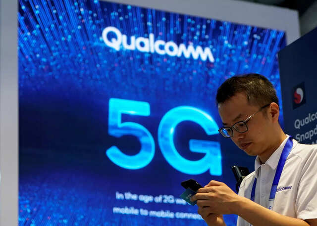 FILE PHOTO: Signs of Qualcomm and 5G are pictured at Mobile World Congress (MWC) in Shanghai, China June 28, 2019. REUTERS/Aly Song/File Photo/File Photo FILE PHOTO: Signs of Qualcomm and 5G are pictured at Mobile World Congress (MWC) in Shanghai, China June 28, 2019. REUTERS/Aly Song/File Photo/File Photo