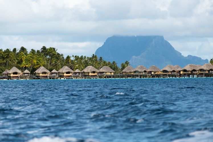 Stay in an overwater villa