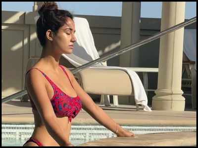 Disha Patani scorches up the internet with her latest picture as she stuns in a red swimsuit