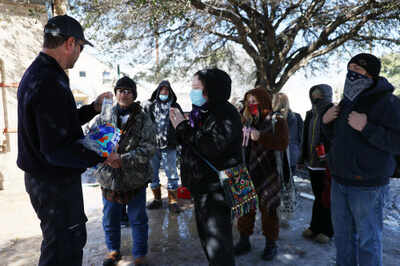 US officially rejoins climate deal as Texas reels under Arctic freeze