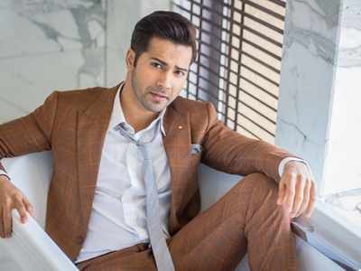 Varun Dhawan looks dapper and handsome in a plaid suit with a grey tie