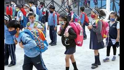 CM Yogi Adityanath greets kids with candy as they return to school
