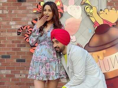 Bigg Boss 13's Shehnaaz Gill flaunts her cute baby bump with Diljit Dosanjh in these pictures from Canada