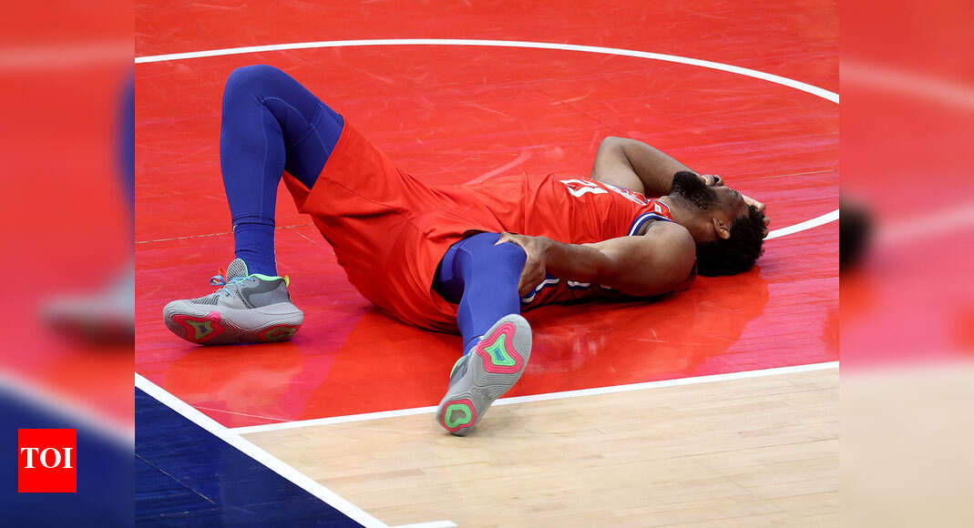 NBA:  NBA roundup: Joel Embiid injures knee in Philadelphia 76ers win | More sports News - Times of India
