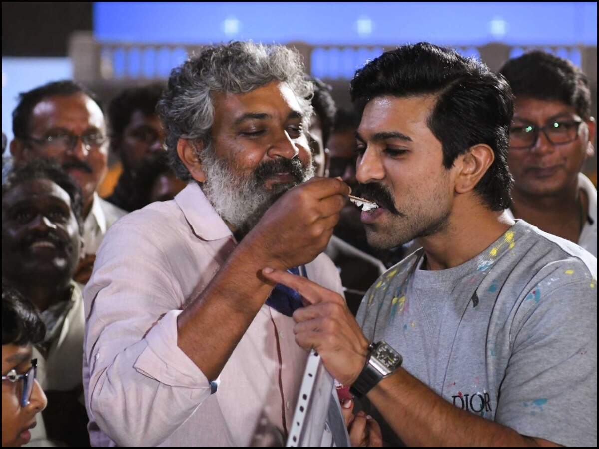 Video: Ram Charan celebrates birthday with Rajamouli &amp; Co on RRR sets | Telugu Movie News - Times of India