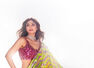 Bollywood beauties shine in sequined saris