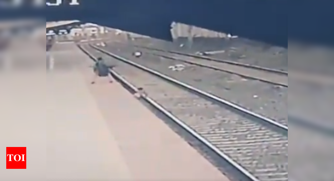 Watch Railway Official Saves 6 Year Old From Getting Run Over By Train