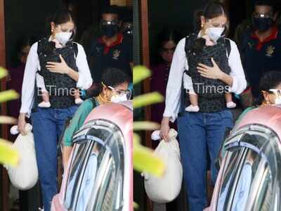 Anushka Sharma manages to hide daughter Vamika's face as she gets papped with husband Virat Kohli at airport