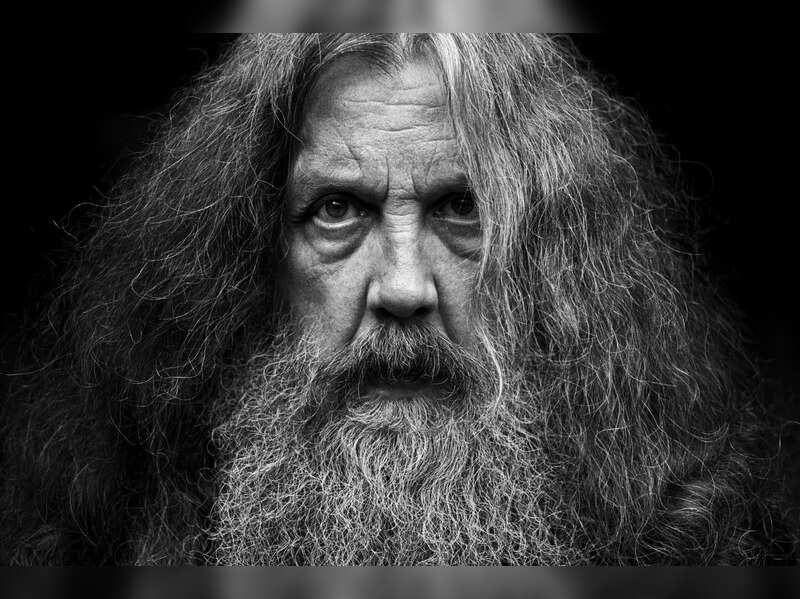 This photo provided by Bloomsbury Publishing shows Alan Moore. The celebrated British author known for "V for Vendetta" and "Watchman" among other works has a deal with Bloomsbury for the story collection "Illuminations" and a five-volume fantasy series, "Long London." In a statement Monday, May 3, 2021, Moore said he was "bursting with fiction, bursting with prose" and thanked his publisher for its commitment to "expanding the empire of the word." (Bloomsbury Publishing/Mitch Jenkins via AP)