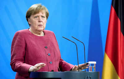 Germany lifts more restrictions, Merkel urges caution