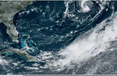 Ana becomes a tropical storm as it moves away from Bermuda