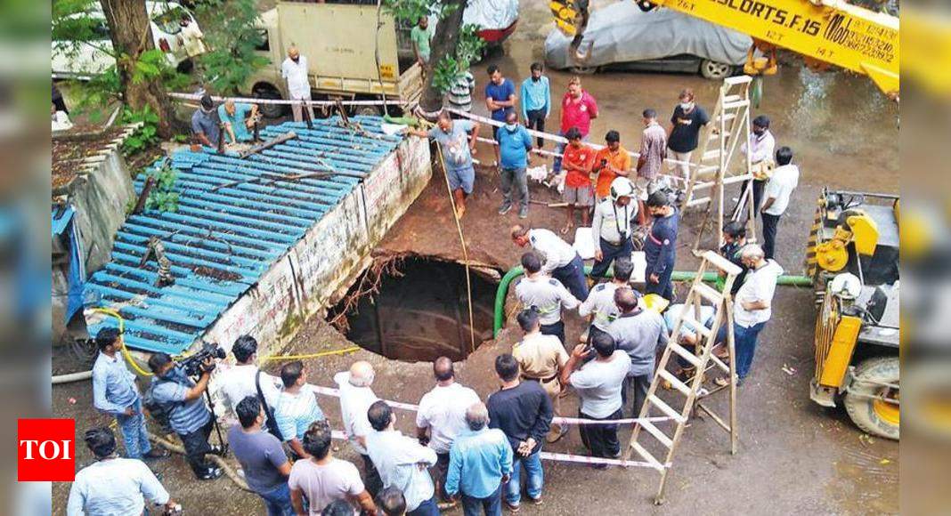 SUV dives into 43ft well as ground caves in