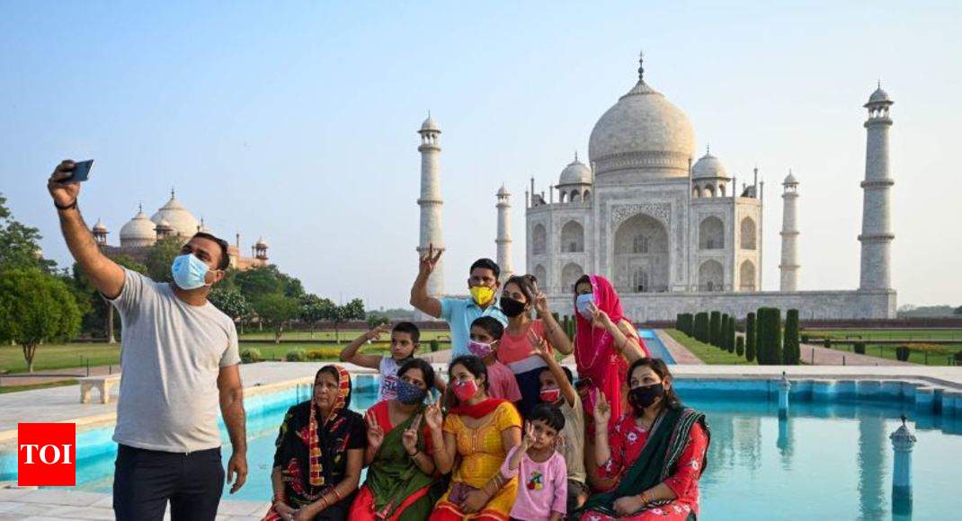 Taj Mahal reopens after 3 months, 650 tourists will be allowed at a time |  Agra News - Times of India