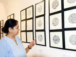 Art lovers attend an exhibition on bottle art and freehand mandalas