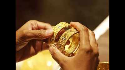 Gold price drops below Rs 50,000 mark in Ahmedabad