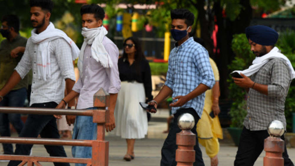 Photos: Masks slip as India ignores Covid norms